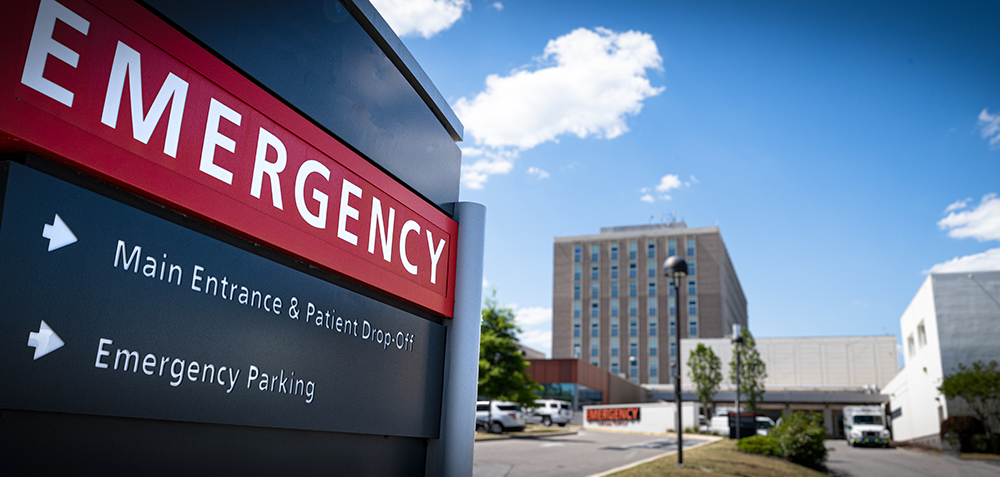 photograph of a hospital direction sign indicating where to go for emergency services